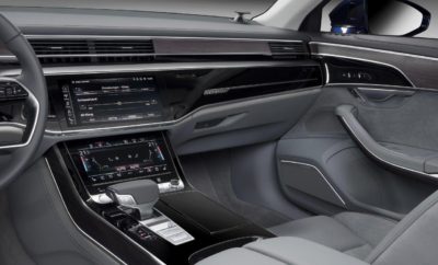 3D ήχος στο νέο Audi A8» • 3D ήχος για πρώτη φορά στα πίσω καθίσματα της 4ης γενιάς της πολυτελούς λιμουζίνας • 23 ηχεία, συμπεριλαμβανομένων τεσσάρων για τη χωρική διάσταση του ύψους • Στενή συνεργασία με την Bang & Olufsen και το Ινστιτούτο Fraunhofer Η ακρόαση μουσικής στο νέο Audi A8 γίνεται μια εκπληκτική εμπειρία. Το προηγμένο σύστημα ήχου της Bang & Olufsen φέρνει τώρα το μοναδικό ακουστικά χαρακτήρα του τρισδιάστατου ήχου και στα πίσω καθίσματα. Έτσι η μάρκα με τους τέσσερις κύκλους προσφέρει απαράμιλλη ποιότητα ήχου στην κορυφαία κατηγορία. Στο νέο Audi A8 η πολυτέλεια είναι ηχηρή! Η νέα γενιά του Audi A8 το καταδεικνύει με εμφατικό τρόπο - με το Bang & Olufsen 3D Advanced Sound System. Το οποίο διαθέτει 23 ηχεία με ιδιαίτερα ελαφρούς και χαμηλής παραμόρφωσης μαγνήτες νεοδυμίου, οι οποίοι παράγουν έναν ήχο υψηλής πιστότητας. Το αποτέλεσμα είναι εντυπωσιακό, ειδικά αν αναπαράγεται ένα κονσέρτο κλασικής μουσικής με υψηλή ποιότητα εγγραφής: Το εσωτερικό μετατρέπεται σε συναυλιακό χώρο, όπου η μουσική ξεδιπλώνεται με τον ίδιο ακριβώς τρόπο που ηχογραφήθηκε στο Μέγαρο Μουσικής - χωρίς τεχνητές επεμβάσεις. Ο ήχος είναι αυθεντικός και γεμάτος συναίσθημα. Άλλωστε η κορυφαία προτεραιότητα των ειδικών ήχου της Audi είναι να κάνουν την ποιότητα του ήχου μια αντανάκλαση της φιλοσοφίας της μάρκας. Οι λεπτομέρειες του ηχοσυστήματος Η μάρκα Audi παρουσίασε για πρώτη φορά 3D (τρισδιάστατο) ήχο το 2015, στο Audi Q7. Στο νέο Audi A8 επεκτείνει την επαναστατική αυτή τεχνολογία και στο πίσω μέρος του αυτοκινήτου. Δύο ηχεία πλήρους εύρους στις εμπρός κολώνες και δύο στην οροφή πάνω από τις πίσω θέσεις εξασφαλίζουν τη χωρική διάσταση του ύψους και αναπτύσσουν τον ήχο surround στην τέλεια στερεοφωνική εμπειρία. Ο ενισχυτής των 1.920 Watt της Bang & Olufsen, ο οποίος λειτουργεί με ιδιαίτερα υψηλή απόδοση χάρη στην τεχνολογία ICEpower, δημιουργεί τον 3D (τρισδιάστατο) ήχο με τη βοήθεια του επεξεργαστή ψηφιακού σήματος. Οι απώλειες θερμότητάς του είναι ιδιαίτερα μικρές και για το λόγο αυτό η ακουστική απόδοσή του είναι υψηλή - όπως άλλωστε αποδεικνύεται από τη λεπτομέρεια του ήχου του. Πέρα όμως από όλα τα άλλα, ενισχύει το σήμα των woofer, που αναπαράγουν έναν ιδιαίτερα γεμάτο ήχο, σαν μια χαμηλή νότα από ένα μουσικό όργανο. Όταν το σύστημα infotainment ενεργοποιείται τα δύο tweeter επεκτείνονται ηλεκτρικά μέσα από το ταμπλό. Χάρη στην τεχνολογία Acoustic Lens της Bang & Olufsen εξασφαλίζουν πως ο ήχος θα διανέμεται σε μια οριζόντια ακτίνα 180 μοιρών. Ξεχωριστά κανάλια ενίσχυσης τροφοδοτούν κάθε ηχείο, ενώ προκειμένου να δημιουργηθεί ο 3D (τρισδιάστατος) ήχος το νέο σύστημα χρησιμοποιεί ένα αλγόριθμο που η Audi έχει εξελίξει σε συνεργασία με το Ινστιτούτο Fraunhofer στο Erlangen. Χρησιμοποιεί στερεοφωνικές ή 5.1 ηχογραφήσεις προκειμένου να υπολογίσει τα δεδομένα για την τρίτη διάσταση και για να τη δημιουργήσει για τα τέσσερα 3D (τρισδιάστατης απόδοσης) ηχεία. Αυτό γίνεται δυναμικά. Με άλλα λόγια, ο αλγόριθμος προσαρμόζεται κάθε φορά στην εκάστοτε ηχογράφηση, προκειμένου να αποφευχθεί τυχόν παραμόρφωση του ήχου. Ακουστική απόλαυση με μεγάλος εύρος ρυθμίσεων Χρησιμοποιώντας το σύστημα MMI καθώς και μια ξεχωριστή μονάδα ελέγχου που μοιάζει με smartphone για τους πίσω επιβάτες οι ρυθμίσεις ήχου μπορούν να βελτιστοποιηθούν με βάση τις προτιμήσεις - με ιδιαίτερη δηλαδή έμφαση στις εμπρός ή τις πίσω θέσεις, ή σε όλες τις θέσεις. Η ρύθμιση με έμφαση στο πίσω μέρος επιτρέπει στους πίσω επιβάτες να απολαμβάνουν την καλύτερη δυνατή ποιότητα 3D (τρισδιάστατου) και surround ήχου. Οι επιβαίνοντες μπορούν πέρα από τα πρίμα και τα μπάσα να ρυθμίσουν, ανεξάρτητα από όλα τα άλλα ηχεία, την ένταση των subwoofer. Επίσης υπάρχει και μια ειδική λειτουργία για κινηματογραφικές ταινίες, η οποία ονομάζεται Movie Set. Tα ηχητικά κομμάτια 5.1 αποδίδονται με τον ίδιο ακριβώς τρόπο όπως μπροστά από τη μεγάλη οθόνη ενός κινηματογράφου. Το σύστημα εντοπίζει κάθε φωνή ξεχωριστά και προσαρμόζει ανάλογα την ισορροπία. Για παράδειγμα, αν ένας χαρακτήρας εμφανίζεται στη δεξιά πλευρά της εικόνας, τότε και η φωνή του ακούγεται από τα δεξιά. Προκλήσεις κατά την εξέλιξη Οι εργασίες για τη σχεδίαση των ηχοσυστημάτων του νέου Audi A8 ξεκίνησαν πολύ νωρίς στη διαδικασία εξέλιξής του. “Η ενσωμάτωση των ηχείων στα σωστά σημεία του αυτοκινήτου είναι το κλειδί για το 80% της ποιότητας ήχου”, εξηγεί ο Wolfram Jähn, μηχανικός εξέλιξης ήχου και ακουστικής για το νέο Α8. “Πρέπει να είναι τοποθετημένα όσο πιο σταθερά γίνεται και έτσι προσαρμόσαμε το subwoofer στο πίσω διαχωριστικό που είναι κατασκευασμένο από πολυμερές ενισχυμένο με ανθρακονήματα. Ο στόχος είναι η απομόνωση του ηχείου, προκειμένου να αποφευχθεί η μεταδόση κραδασμών από το αμάξωμα”. Τα καλύμματα των ηχείων είναι ένας ακόμα παράγοντας καθοριστικής σημασίας. Για τα στοιχεία αυτά οι σχεδιαστές και οι μηχανικοί ήχου της Audi συνεργάστηκαν στενά με τους ειδικούς της Bang & Olufsen. Τα καλύμματα πρέπει να έχουν τη μέγιστη δυνατή ακουστική διαφάνεια, ενώ ταυτόχρονα θα πρέπει και να προστατεύουν. Πρόκειται δηλαδή για την εύρεση της ιδανικής ισορροπίας μεταξύ των ανοικτών και των κλειστών επιφανειών. Στο Audi A8 διάτρητα καλύμματα υψηλής ακρίβειας κατασκευασμένα από διπλά ανοδιωμένο αλουμίνιο καλύπτουν και κοσμούν τα ηχεία στις εμπρός και τις πίσω πόρτες. Ταυτόχρονα τα woofer φωτίζονται από λευκού χρώματος LED. Η βάση για τα κορυφαίας ποιότητας συστήματα ήχου είναι η ποιότητα κάθε μεμονωμένου στοιχείου και εξαρτήματός τους. Μια αφοσιωμένη ομάδα O high end ήχος είναι μια από τις βασικές επιδιώξεις της Audi. Η συνεργασία της με την Bang & Olufsen ξεκίνησε με την αλλαγή της χιλιετηρίδας. Από το 2005 το A8 μπορούσε να εξοπλιστεί με το Advanced Sound System της εξειδικευμένης εταιρείας από τη Δανία. Αυτό σημαίνει πως η Audi ήταν ο πρώτος κατασκευαστής που είχε τη δυνατότητα να διαθέτει ένα εργοστασιακό high end ηχοσύστημα. Στο νέο Audi A8 η Bang & Olufsen παρέχει τόσο το Advanced όσο και το Premium Sound System. Μόλις ανοίξει η πόρτα ένα χαρακτηριστικό jingle (χαρακτηριστική σύντομη μελωδία), μια σύνθεση που έχει γραφτεί ειδικά για το Α8, υποδέχεται τους επιβάτες. Ταυτόχρονα ο ειδικά μελετημένος φωτισμός παρουσιάζει το εσωτερικό της πολυτελούς λιμουζίνας με έναν μοναδικό τρόπο. “Επιλέγουμε τον καλύτερο συνεργάτη για κάθε πρότζεκτ”, σημειώνει ο Mario Fresner, Διευθυντής Εξέλιξης Ήχου στην Audi AG. To Ινστιτούτο Frauenhofer παίζει επίσης έναν καθοριστικό ρόλο σε αυτήν τη διαδικασία. Ο Mario Fresner εξηγεί: “Η Bang & Olufsen εκτελεί τις βασικές ρυθμίσεις του συστήματος στις εγκαταστάσεις της. Εμείς εξελίσσουμε ανεξάρτητα, εδώ στο Ingolstadt, το σύστημα και τα μεμονωμένα εξαρτήματα του εις βάθος, ενώ οι εργασίες του 3D (τρισδιάστατου) συντονισμού γίνονται στο Erlangen. Όλοι όσοι εμπλέκονται έχουν τον ίδιο στόχο: να προσφέρουν στους πελάτες μας το καλύτερο δυνατό ηχοσύστημα - που θα είναι τεχνολογικά εξαιρετικά προηγμένο και ικανό να μεταφέρει το συναίσθημα που υπάρχει στη μουσική”.