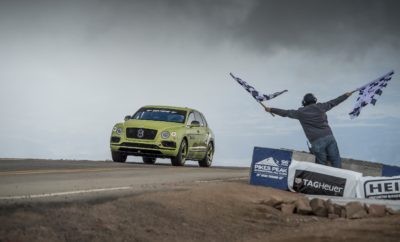 H Bentley Bentayga σπάει το ρεκόρ των SUV στο Pikes Peak • H Bentley Bentayga κατέρριψε το ρεκόρ των SUV παραγωγής στο Pikes Peak • Ο Ρις Μίλλεν (Rhys Millen) ολοκλήρωσε τη διαδρομή σε 10΄ 49΄΄ 9 εκατοστά • Η πολύ κοντινή στην έκδοση δρόμου Bentayga W12 πέτυχε μέση ταχύτητα 106,4 χλμ./ώρα • Η Bentley Motors θα γιορτάσει την επίτευξη του ρεκόρ με μία ειδική, περιορισμένης παραγωγής έκδοση της Bentayga Η Bentley για άλλη μια φορά απέδειξε ότι είναι η μόνη αυτοκινητοβιομηχανία που μπορεί να συνδυάσει κορυφαία πολυτέλεια και συγκλονιστικές επιδόσεις. Μία Bentley Bentayga, με οδηγό τον Ρις Μίλλεν (Rhys Millen), δύο φορές πρωταθλητή της Formula D (πρωτάθλημα drifting) στις Η.Π.Α., ολοκλήρωσε την ανάβαση του Pikes Peak σε μόλις 10΄ 49΄΄ 9 εκατοστά. Η επίδοση αυτή, με μέση ταχύτητα 106,4 χλμ./ώρα, ήταν σχεδόν 2 λεπτά πιο γρήγορη σε σχέση με το προηγούμενο ρεκόρ,. Στα 1.440 μέτρα της υψομετρικής διαφοράς και στις συνολικά 156 στροφές της ανάβασης, η Bentayga αξιοποίησε πλήρως το μοναδικό συνδυασμό των 608 ίππων και των 900 Nm του W12 κινητήρα, της ενεργητικής πνευματικής ανάρτησής της, του ενεργητικού ελέγχου των κλίσεων του αμαξώματος με τη βοήθεια ηλεκτρικού κυκλώματος 48V και των φρένων της από κεραμικά υλικά και ανθρακονήματα ώστε να σημειώσει ένα νέο σημείο αναφοράς. Μιλώντας μετά την ολοκλήρωση της ανάβασής του ο Ρις Μίλλεν είπε: «Φανταστικό αυτοκίνητο! Το να πάρεις ένα υπερπολυτελές SUV με ελάχιστες τροποποιήσεις και να μπορείς να ολοκληρώσεις αυτήν την ανάβαση σε λιγότερα από 11 λεπτά είναι μια τεράστια απόδειξη για τις επιδόσεις και το επίπεδο της τεχνολογίας της Bentayga. Το αυτοκίνητο ήταν “βιδωμένο” σε όλη τη διάρκειά της και μου δημιουργούσε την αίσθηση εμπιστοσύνης που χρειαζόμουν προκειμένου να πιέσω και άλλο». Σε σχέση με τις Bentayga παραγωγής είχαν γίνει ελάχιστες αλλαγές, για λόγους εναρμόνισης με τους κανονισμούς. Τα εμπρός καθίσματα είχαν αντικατασταθεί από άλλα αγωνιστικών προδιαγραφών, ενώ το πίσω κάθισμα είχε αφαιρεθεί. Ταυτόχρονα είχε τοποθετηθεί κλωβός ασφαλείας (roll cage) και σύστημα πυρόσβεσης. Τα λάστιχα είχαν επιλεγεί από τη γκάμα DOT της Pirelli, ενώ είχε τοποθετηθεί και μια σπορ εξάτμιση της Akrapovic σύμφωνη με τις προδιαγραφές παραγωγής. Προκειμένου να γιορτάσει την επίτευξη του ρεκόρ, η Bentley ανακοίνωσε μια νέα έκδοση της Bentayga, η οποίας θα παραχθεί σε μόλις 10 κομμάτια. Εξελιγμένη και κατασκευασμένη στο χέρι από την Mulliner -το εσωτερικό τμήμα ειδικών κατασκευών της Bentley- η Pikes Peak Bentayga θα φορά τον ίδιο κινητήρα και τις ίδιες αναρτήσεις με την αγωνιστική που κατέρριψε το ρεκόρ. Το αμάξωμα της Pikes Peak Bentayga είναι βαμμένο είτε στο βαθύ Beluga black είτε στο εντυπωσιακό Radium και εξοπλίζεται με ζάντες 22΄΄. Έχουν προστεθεί εμπρός αεροτομή, πλευρικές «φούστες», διαχύτης και πίσω αεροτομή, όλα από ανθρακονήματα, ενώ ένα χαρακτηριστικό λογότυπο Pikes Peak κοσμεί τα εμπρός φτερά. Στο εσωτερικό υπάρχουν εντυπωσιακές διχρωμίες, που συνδυάζουν λεπτομέρειες σε Key Lime με το δέρμα Beluga και με στοιχεία από Alcantara στα καθίσματα και τις πόρτες. Επενδυμένα με Alcantara είναι τόσο το τιμόνι όσο και ο επιλογέας του κιβωτίου, ενώ η οροφή είναι από ύφασμα Eliade. Τέλος, στις εσωτερικές επενδύσεις από ανθρακόνημα υπάρχει αριθμημένη πλακέτα και ένα πολύ ιδιαίτερο Pikes Peak λογότυπο. H Pikes Peak Bentley Bentayga θα είναι διαθέσιμη για παραγγελία από τον Αύγουστο, για πελάτες της μάρκας στις Η.Π.Α. και την Ευρώπη.